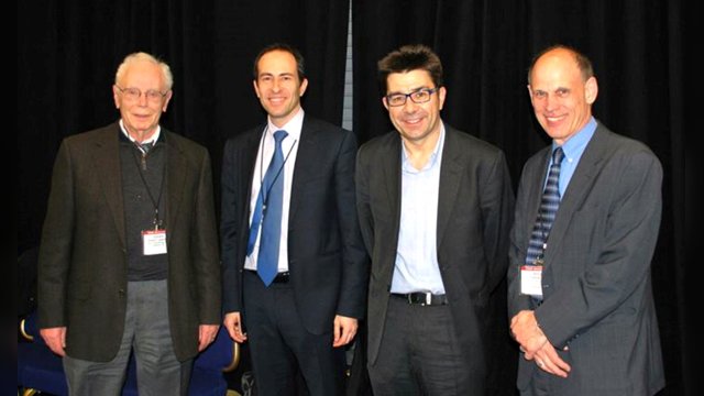 Jordi Casas and Vincenzo Punzo standing with two colleagues at the TRB 2013 Annual Meeting
