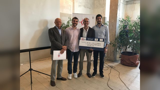 Marcello Montanino, Vincenzo Punzo and team members from Inputspace holding the Switch to Sustainability award at Naples Airport