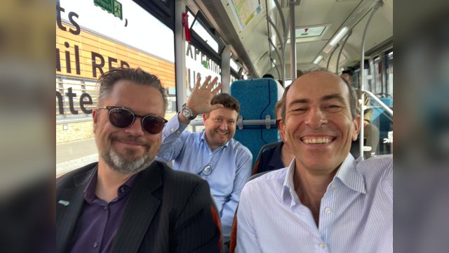 Vincenzo Punzo taking a selfie aboard an autonomous bus with Andrea de Candido of the European Commission's Directorate-General for Research and Innovation and another CCAM Partnership member
