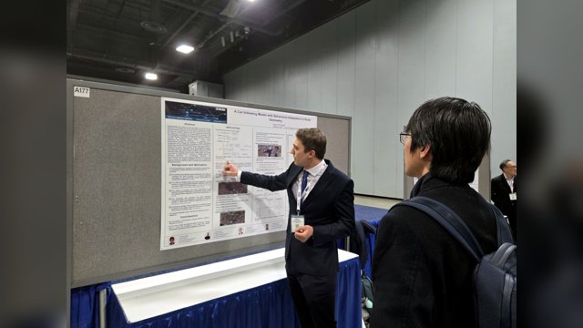 Fabrizio Pelella explaining a poster titled A Car-Following Model with Behavioral Adaptation to Road Geometry