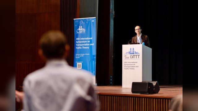Vincenzo Punzo addressing the ISTTT26 audience from the main lectern in Munich
