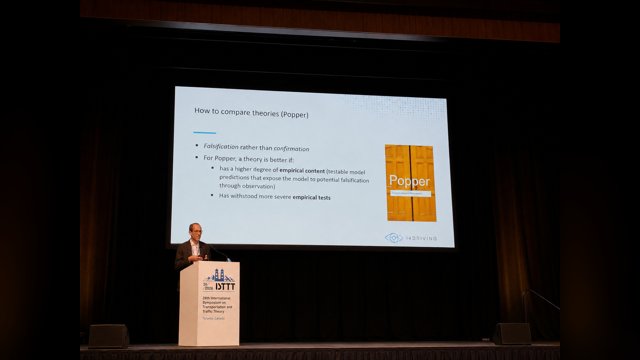 An ISTTT26 presentation slide on comparing scientific theories using Popperian falsification