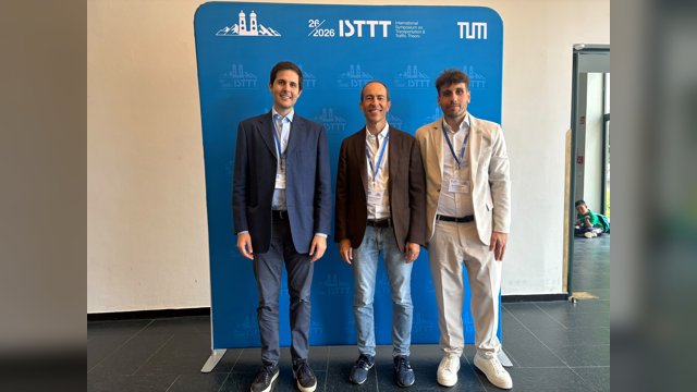 Marcello Montanino, Vincenzo Punzo and Davide Iannelli standing in front of the ISTTT26 backdrop