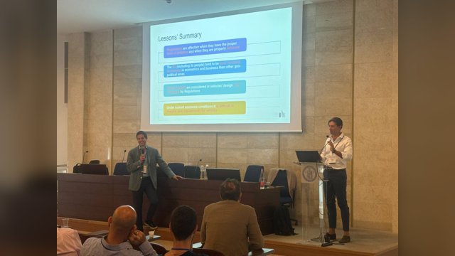Marcello Montanino and Biagio Ciuffo speaking below a projected slide during a keynote session at MFTS 2026
