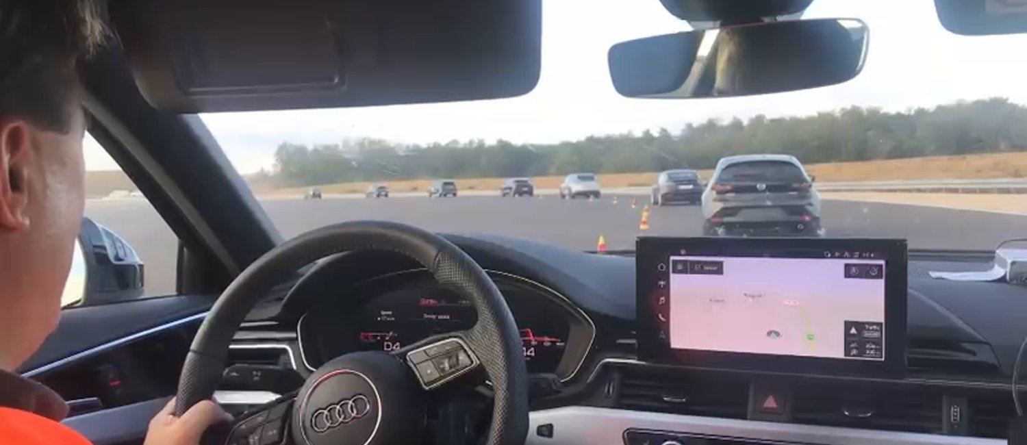 A convoy of adaptive-cruise-control-equipped production cars driving during the ZalaZONE string-stability experiment